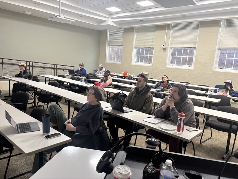 Students sitting at long tables