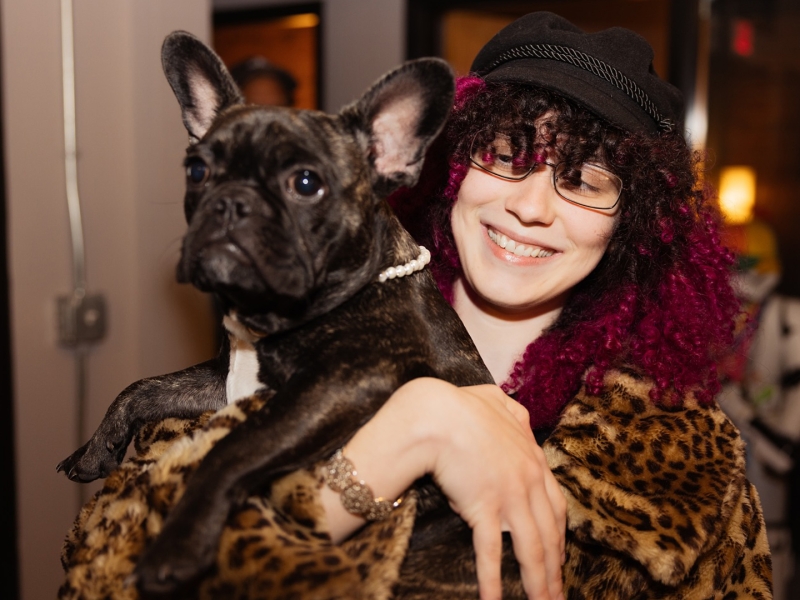 Student holding a dog